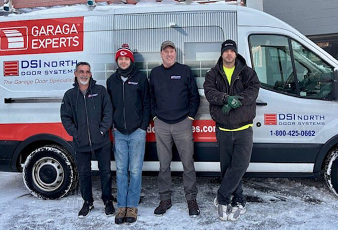 DSI North Door Systems team installers in Peabody in front of a truck services